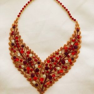 Every color of red . Conversation piece necklace
